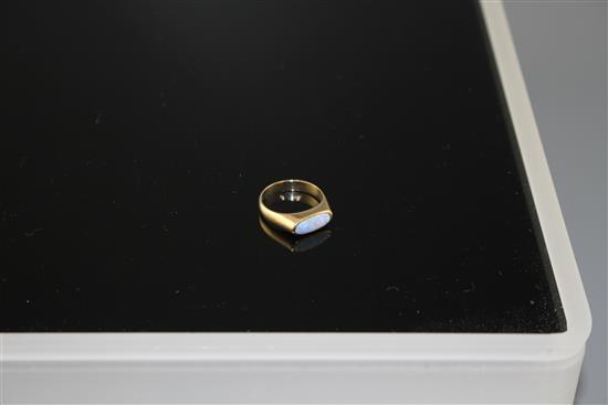 A modern 9ct gold and collet set white opal set dress ring, size M, gross weight 3.9 grams.